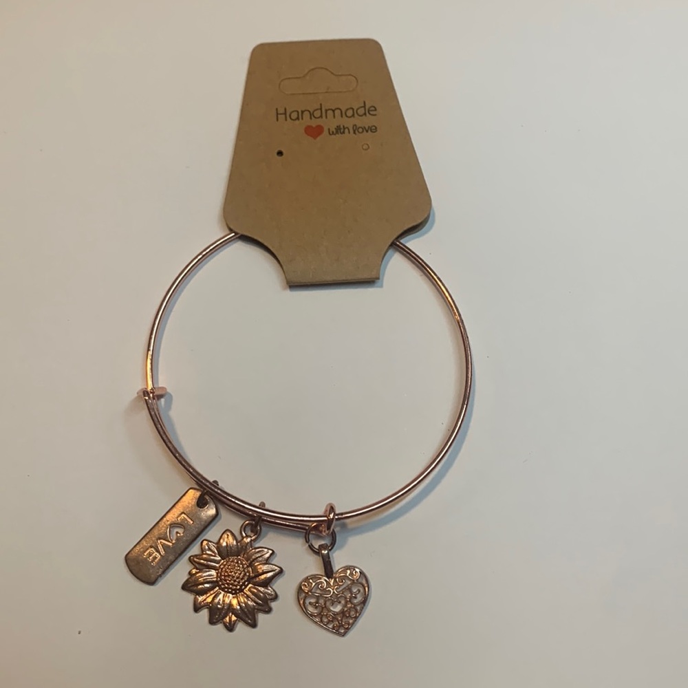 Handmade  rose gold stainless steel bracelet with 3 charms.